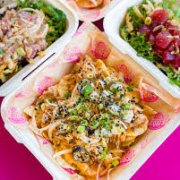 Hurricane Poke Nachos · Tortilla chips loaded with hurricane style tsunami poke. Paia adds cheese